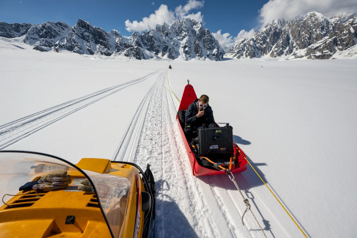 Michael Christoffersen, a researcher at the University of Arizona, monitors the radar system during the survey.